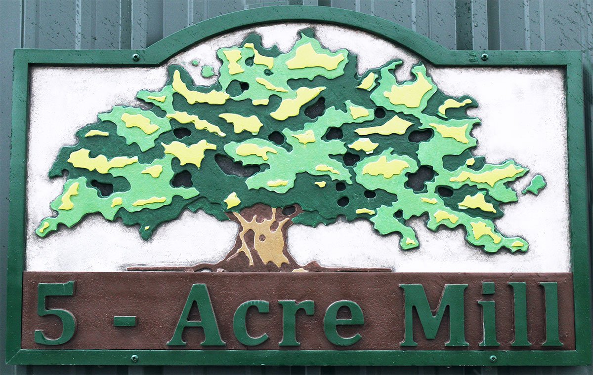 Image of a custom made wood tree sign showing our craftsmenship.